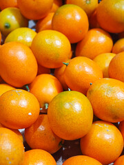 Lots of little cumquat or kumquat background.