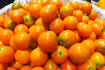Lots of little cumquat or kumquat background.