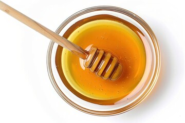 A spoonful of honey is sitting in a bowl. The spoon is wooden and is sticking out of the honey. And it looks delicious