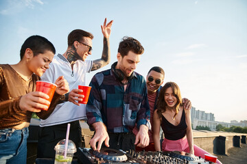 diverse joyful people in vibrant outfits partying together next to handsome DJ at rooftop party