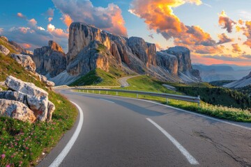 A road with a mountain in the background. The road is empty and the sky is orange