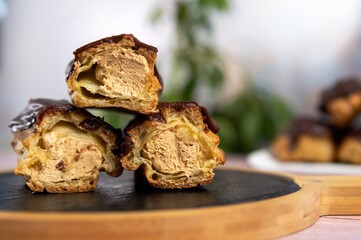French ecler with chocolate. Traditional french dessert eclair.