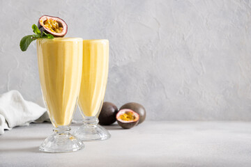 Indian Passion Fruit Lassi on gray background. Traditional healthy beverage with passionfruit ,...