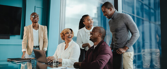 Successful business meeting with happy colleagues collaborating in a professional office
