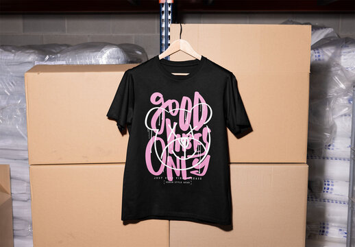 Mockup of customizable t-shirt hanging on box