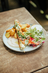grilled chicken skewer with roasted potatoes on wood table summer cafe