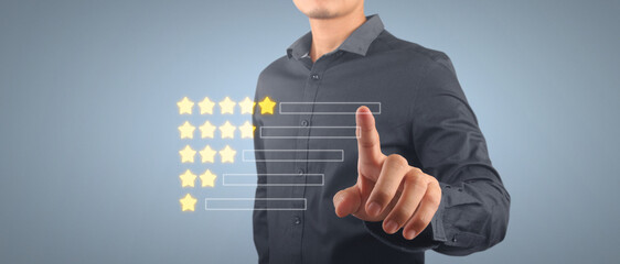 Hand customer giving  five star rating on smartphone