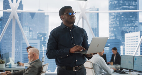 African American Financial Analyst Walking In Skyscraper Office With Diverse Employees In Downtown....