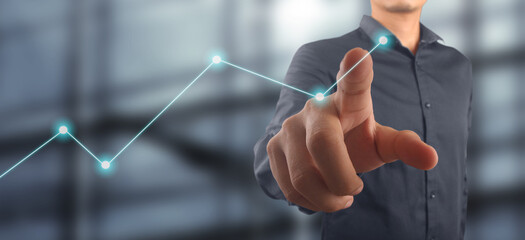 Businessman plan graph growth and increase of chart positive indicators in his business