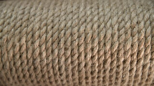 Jute rope in a skein close-up. Background made of natural organic threads. Macro shot. Environmentally friendly Material for creativity. Made from the Corchorus capsularis plant.