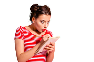 Close-up portrait of her she nice-looking cute attractive glamorous funny focused childish girl wearing striped t-shirt writing notes copybook isolated over pink pastel background