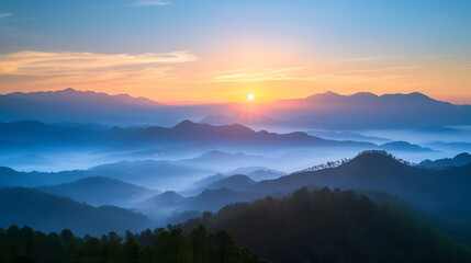 serene sunrise over a misty mountain range