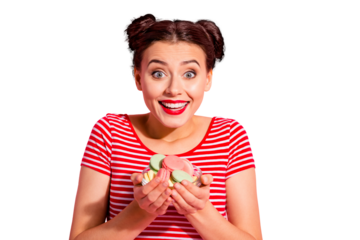 Close-up portrait of her she nice cute charming attractive glamorous shine lovely hungry cheerful girl in striped t-shirt holding in hands pile of colorful delicious snack isolated on pink background