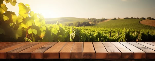Fotobehang Empty wood table top with on blurred vineyard landscape background, for display or montage your products. Agriculture winery and wine tasting concept. digital ai art © Sanych