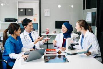 Fototapeta premium Medical, meeting and doctors with laptop for research, planning and hospital schedule management. Health, professional and people team for brainstorming in hospital