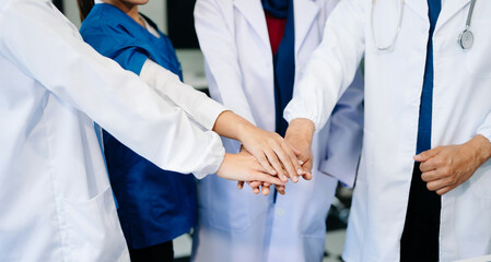 Team Doctors nurses union coordinate hands Teamwork Concept in hospital for success and trust in...