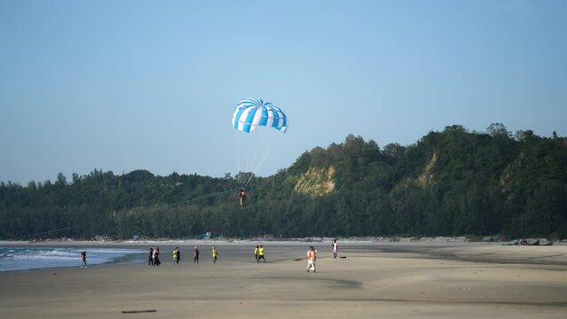 Parasailing at Cox's Bazar. World&rsquo;s longest unbroken sea beach at Cox&rsquo;s Bazar, Bangladesh. With its sandy shores stretching as far as the eye can see, this coastal paradise offers a tranquil escape.