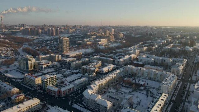 Aerial view of the city of Cheboksary, Russia 2021. Landscape of the city of Cheboksary. Colorful winter sunset scene with pink purple sky.