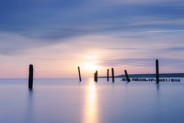 Low angle view of beautiful sunrise along the coast of the UNESCO Wadden Sea on Dutch island
