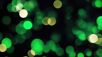 Obraz premium Abstract blur bokeh banner background. Gold bokeh on defocused Black and Green background