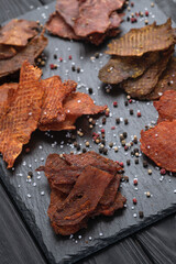 Mix of dried meat Jerky . From chicken , beef and pork.