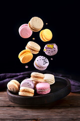 Sweet  macarons assorted on dark background. Clipping Path.
