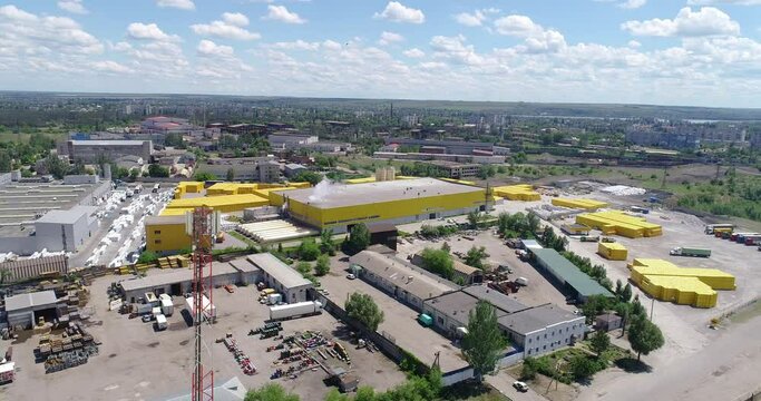 Data transmission through a repeater. A repeater on the territory of a large factory. Mobile tower.