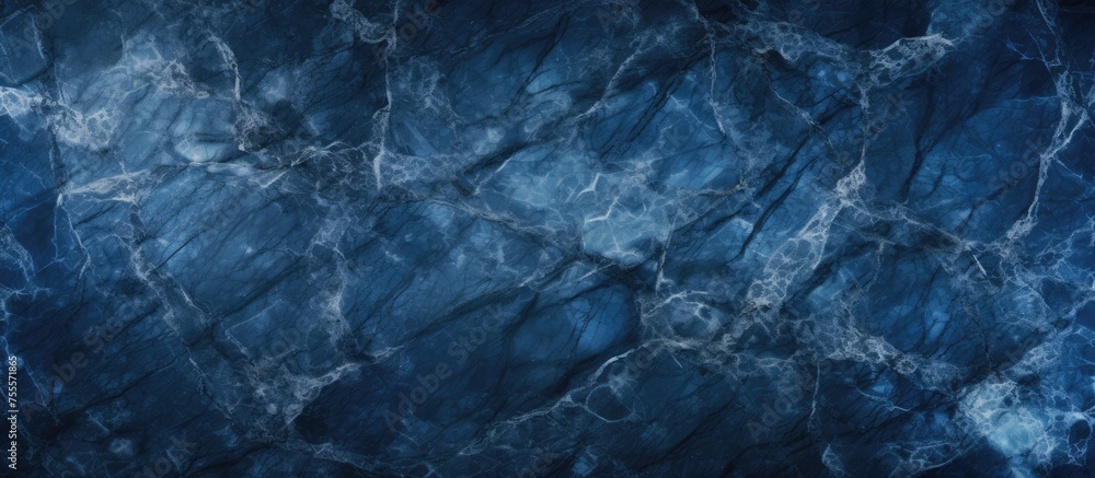Poster a close-up view of a dark blue marble texture background, showcasing intricate cracks and patterns. 