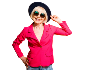 Portrait of charming elderly woman in a red jacket and hat isolated on brigth yellow background with copy space for text