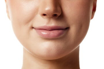 Close up photo of young woman with beautiful, plump, moisturized lips against white studio...