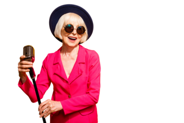 Portrait of happy old woman holding a microphone stand and singing isolated on vivid yellow background with copy space for text