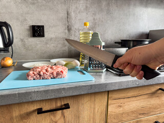 Fresh minced pork with egg, salt oil  on the kitchen table