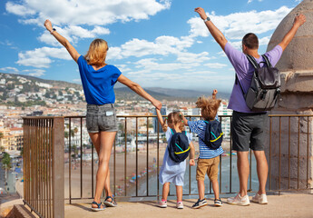 Happy family in Spain excited to discover Peniscola castle - 755574262