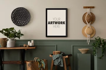 Fotobehang Warm and cozy composition of living room interior with mock up poster frame, braided bag, hat, wooden bench, stool, macrame, green stand and personal accessories. Home decor. Template. © FollowTheFlow