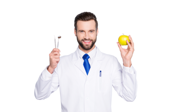 Portrait of successful toothy dentist in white lab coat, blue tie, holding equipments and green apple in hands, isolated on grey background, recommend taking care about teeth - Powered by Adobe