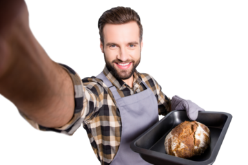 Self portrait of handsome joyful  baker wearing oven-glove, potholder in uniform shooting selfie on front camera having tray with fresh bread, isolated on grey background