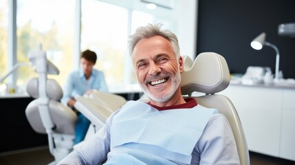 Fototapeta premium A mature happy Man, patient in a chair in a dental clinic. Dentist, orthodontist, Teeth whitening, Brushing, Braces, Veneers, Caries treatment, pulpitis, periodontitis, Oral hygiene, teeth check-up.