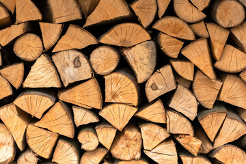 Split hardwood firewood stacked in a row to dry. Dry firewoods texture - 755591872