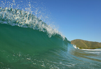 an impressive wave on a beach in the Caribbean Sea