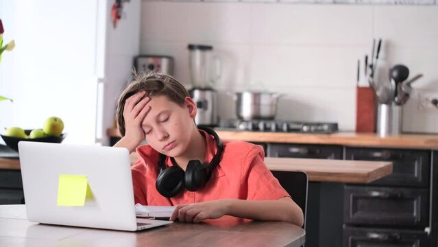 Teen male getting sleep during boring lesson