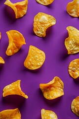 A close-up of golden potato chips on a deep purple background