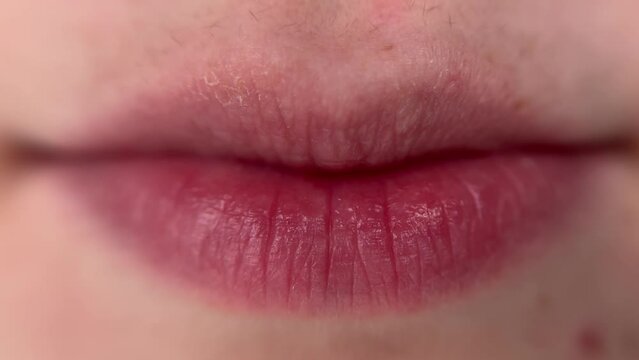 woman swallows vitamin, nutritional supplement, omega 3, close-up on camera.
