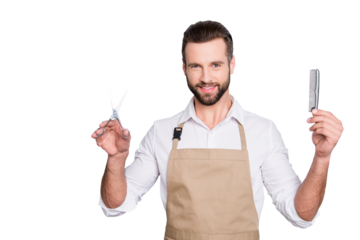 Portrait of cheerful, joyful barber with stubble in shirt having scissors, tools, equipments, comb in hands looking at camera isolated on grey background