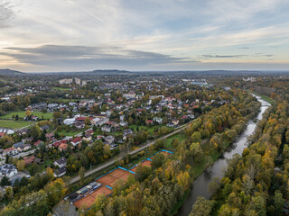 Scenery of the town and health resort in Ustron on the hills of the Silesian Beskids, Poland. Aerial drone view of beskid mountains in Ustron. Ustron Aerial View. Vistula River flows through Ustron.