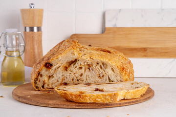 Homemade freshly baked sourdough bread. Craft homemade baked bread, rye and white, on a white...