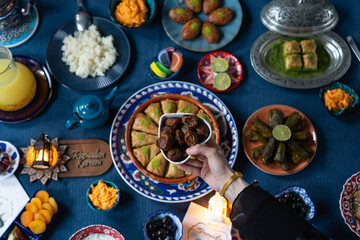Ramadan Iftar Table. Muslim Family Having Dinner At Home. Iftar Table with Traditional Food....