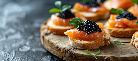 appetizer of salmon and caviar. canapés with smoked salmon and black sturgeon caviar.
