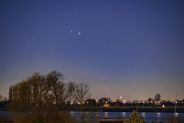 Jupiter and Saturn planets in the night sky appearing as a rare phenomenon at dusk during winter....