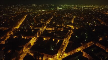 Aerial View of City Streets Illuminated at Night.