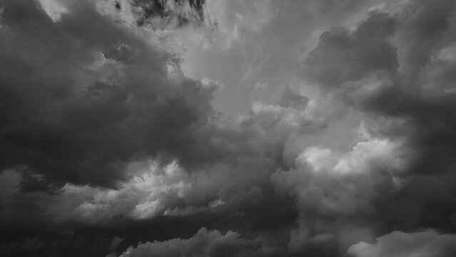 Storm clouds and lot of lightning during a thunderstorm. Dramatic clouds moving fast, 4k